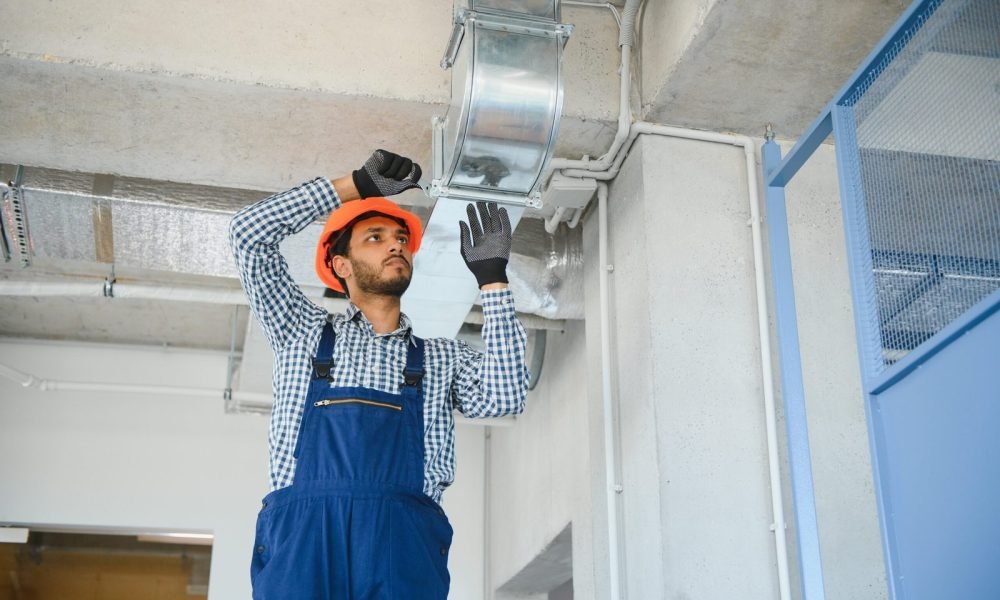 hvac-services-indian-worker-install-ducted-pipe-system-ventilation-air-conditioning-house-scaled.jpg